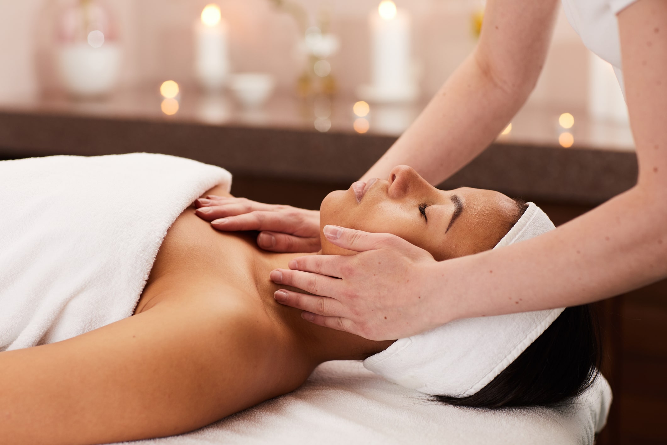 Young Woman Enjoying Facial Massage